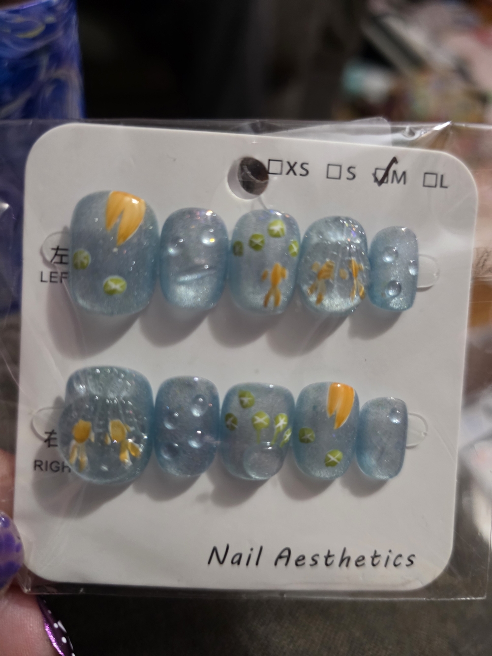 Sparkling Blue Press-On Nail Set with Yellow Floral Accents